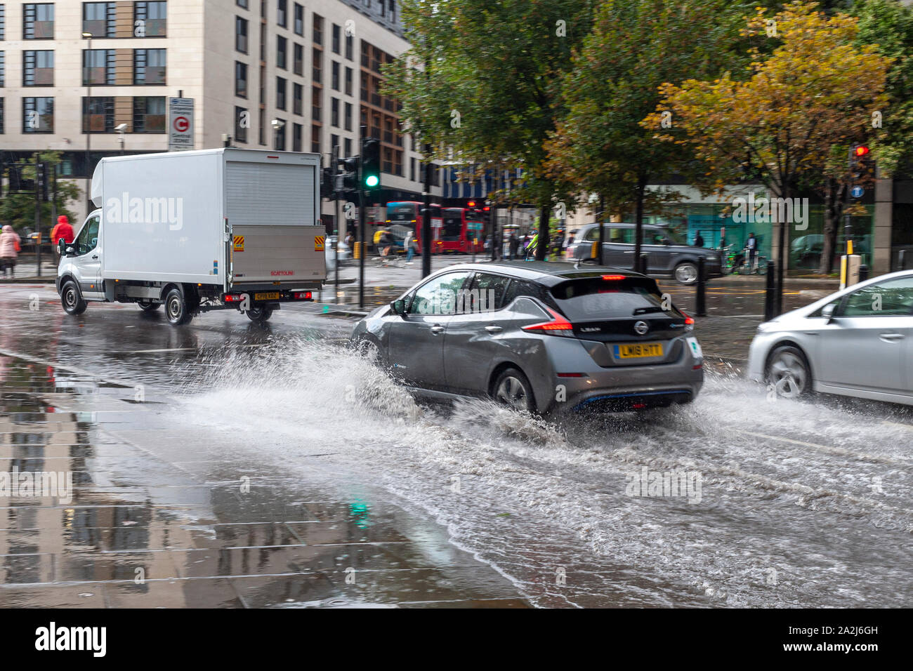 Heavy rain and flooding on roads at Tower Hill, London, UK October 2019 Stock Photo
