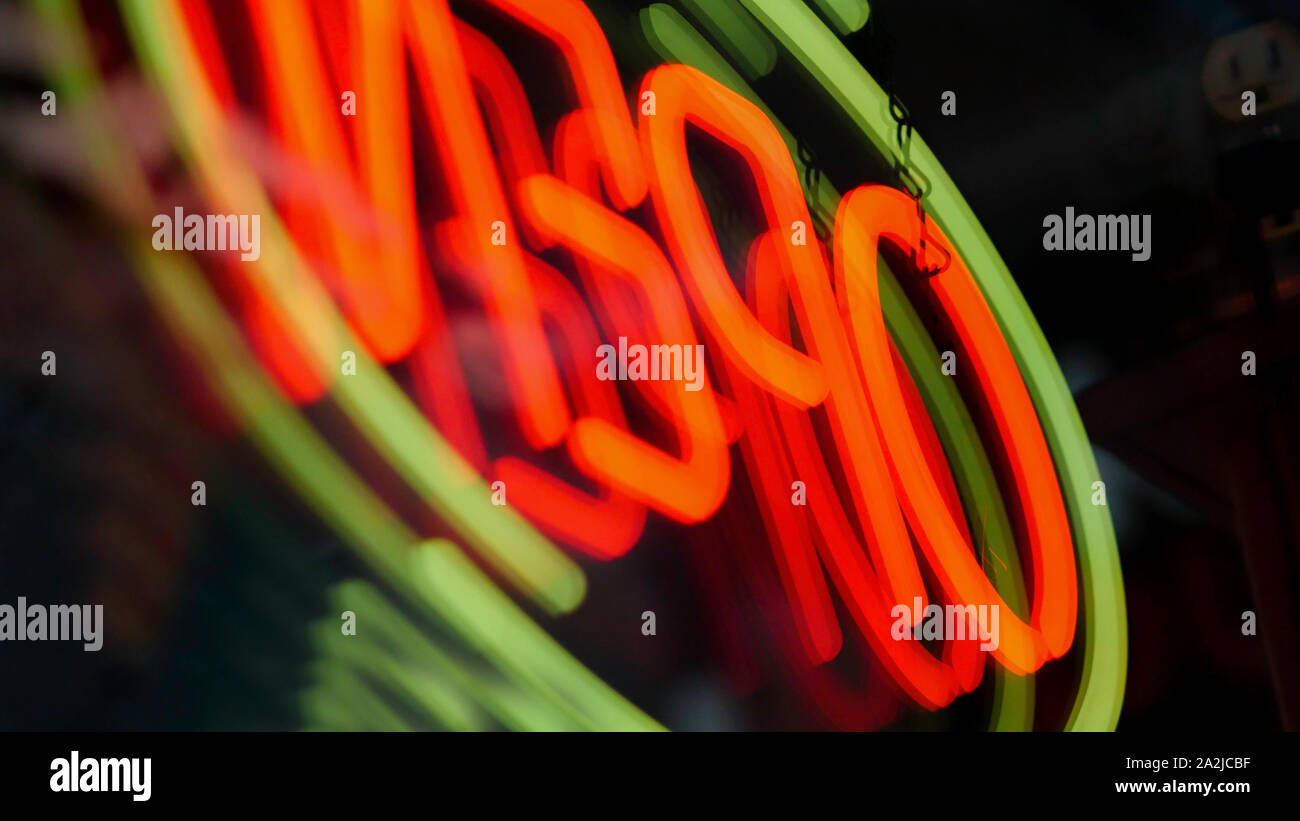 Open neon sign with reflection - Glowing LED Open sign. Stock Photo
