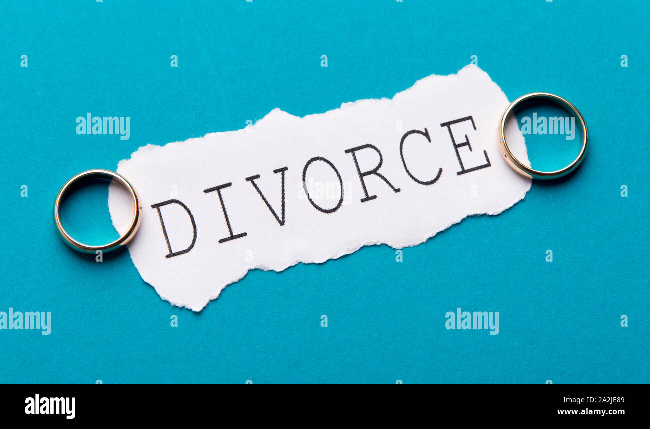 Divorce concept with two wedding rings separately laying Stock Photo
