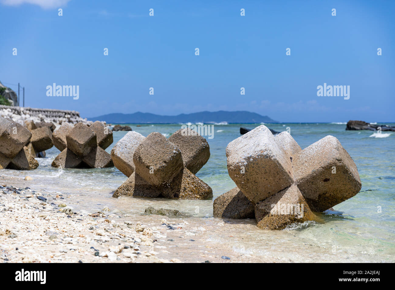 Concrete breakwater modules (hexapods) on beach in Okinawa, Japan Stock Photo