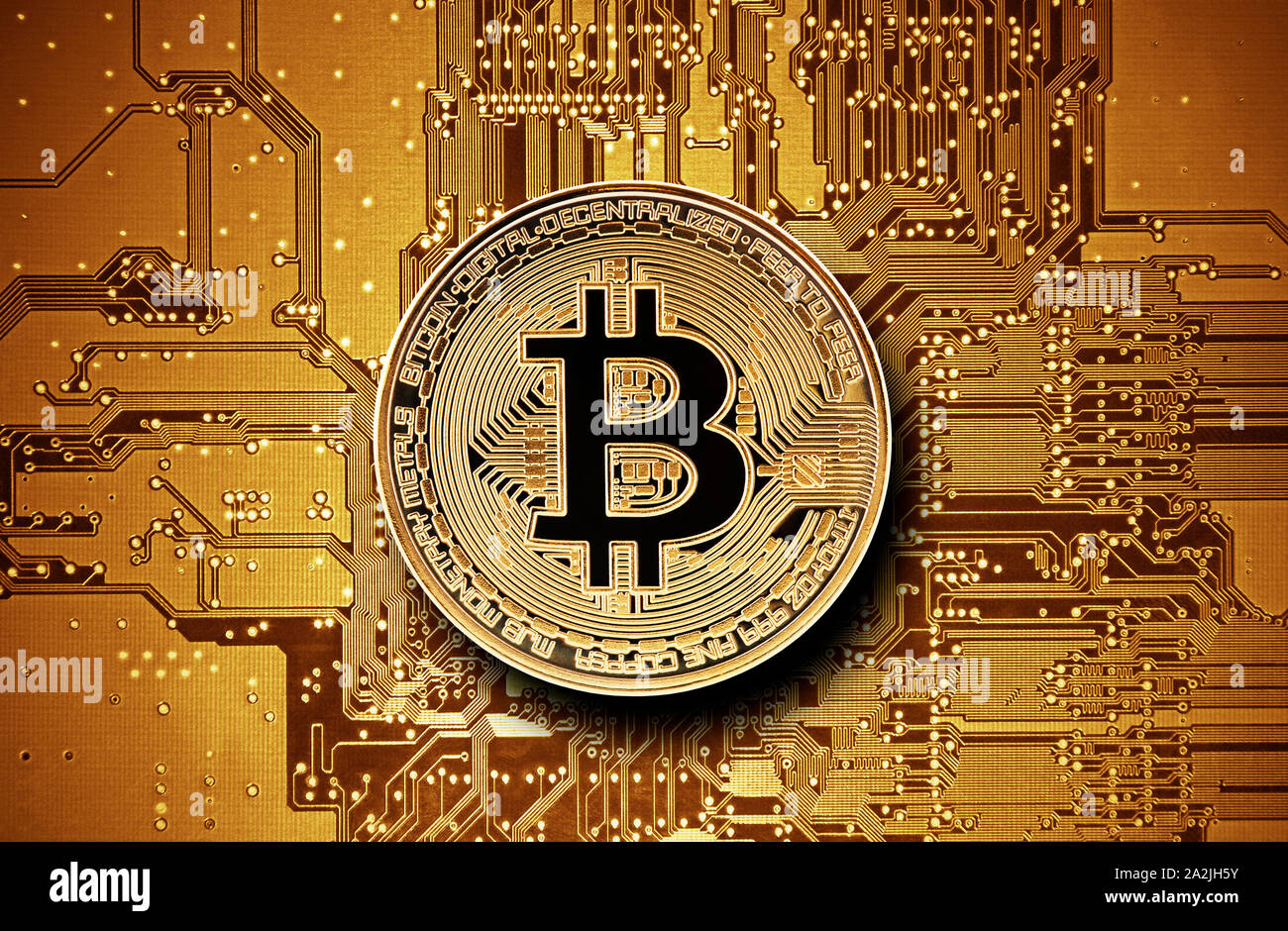 Bitcoin golden coin on computer circuit board Stock Photo
