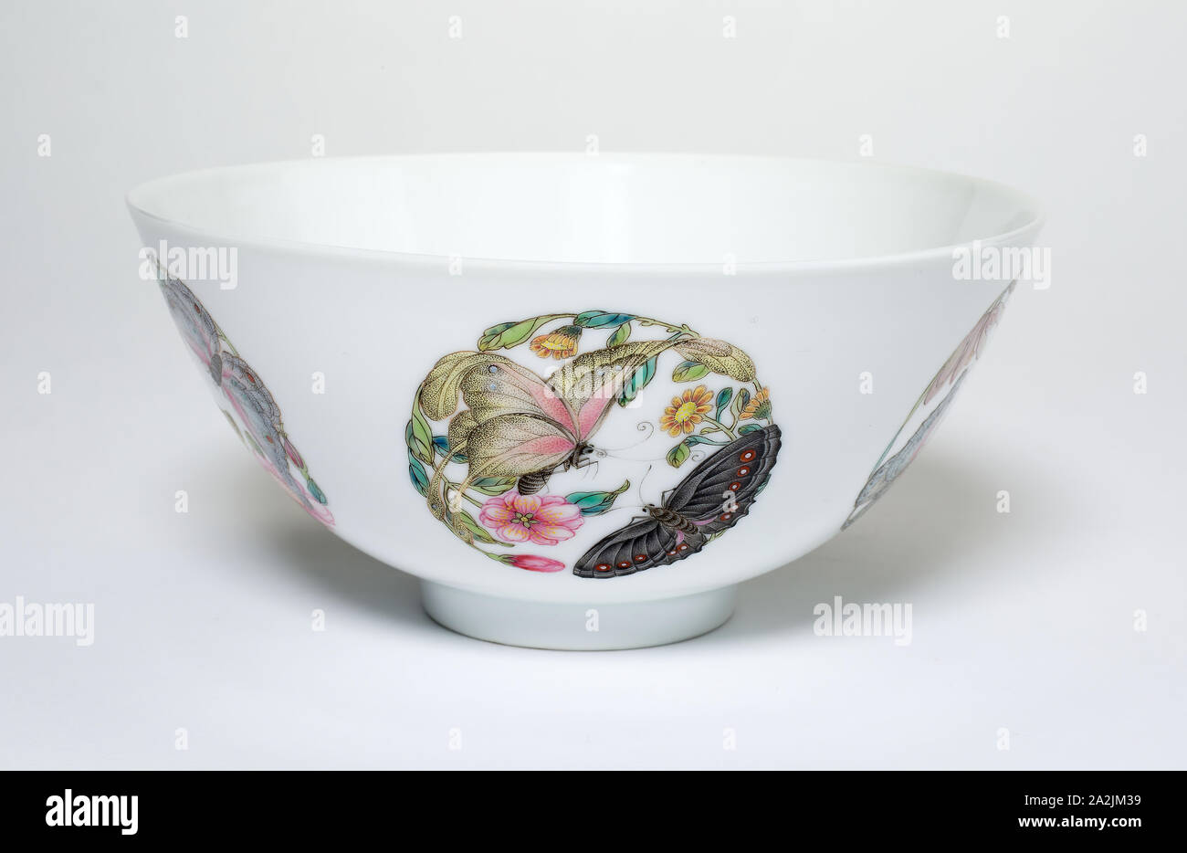 Bowl with Medallions of Butterflies, Peonies, Chrysanthemums, Peaches, Plums and Orchids, Qing dynasty (1644–1911), spurious reign mark of Yongzheng (1723–35), overglaze painting perhaps added later, China, Porcelain painted in overglaze famille rose enamels, H. 6.7 cm (2 5/8 in.), diam. 14.4 cm (5 11/16 in Stock Photo