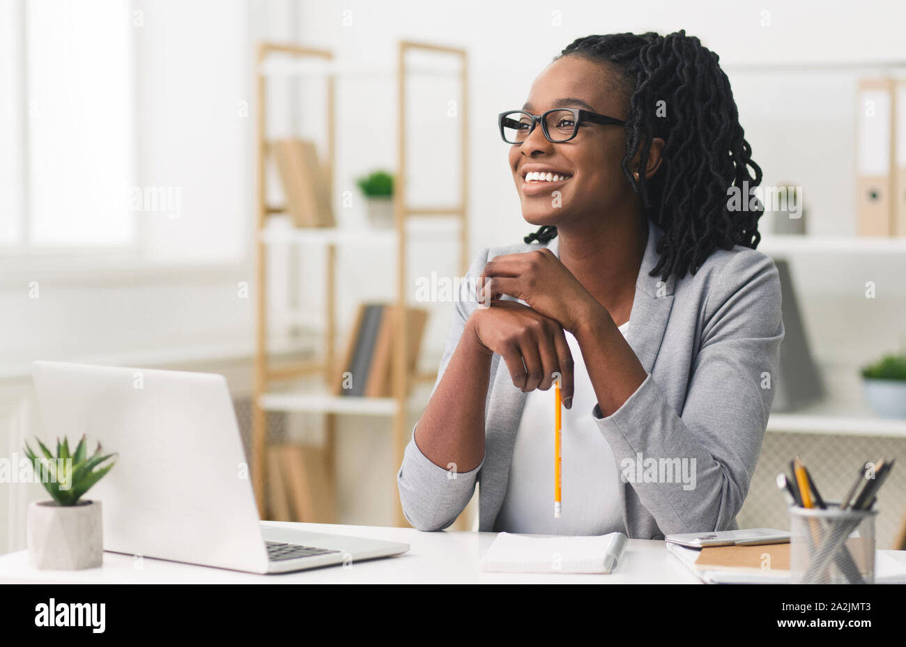 Young Afro Business Lady Smiling Sitting In Modern Office Stock Photo ...