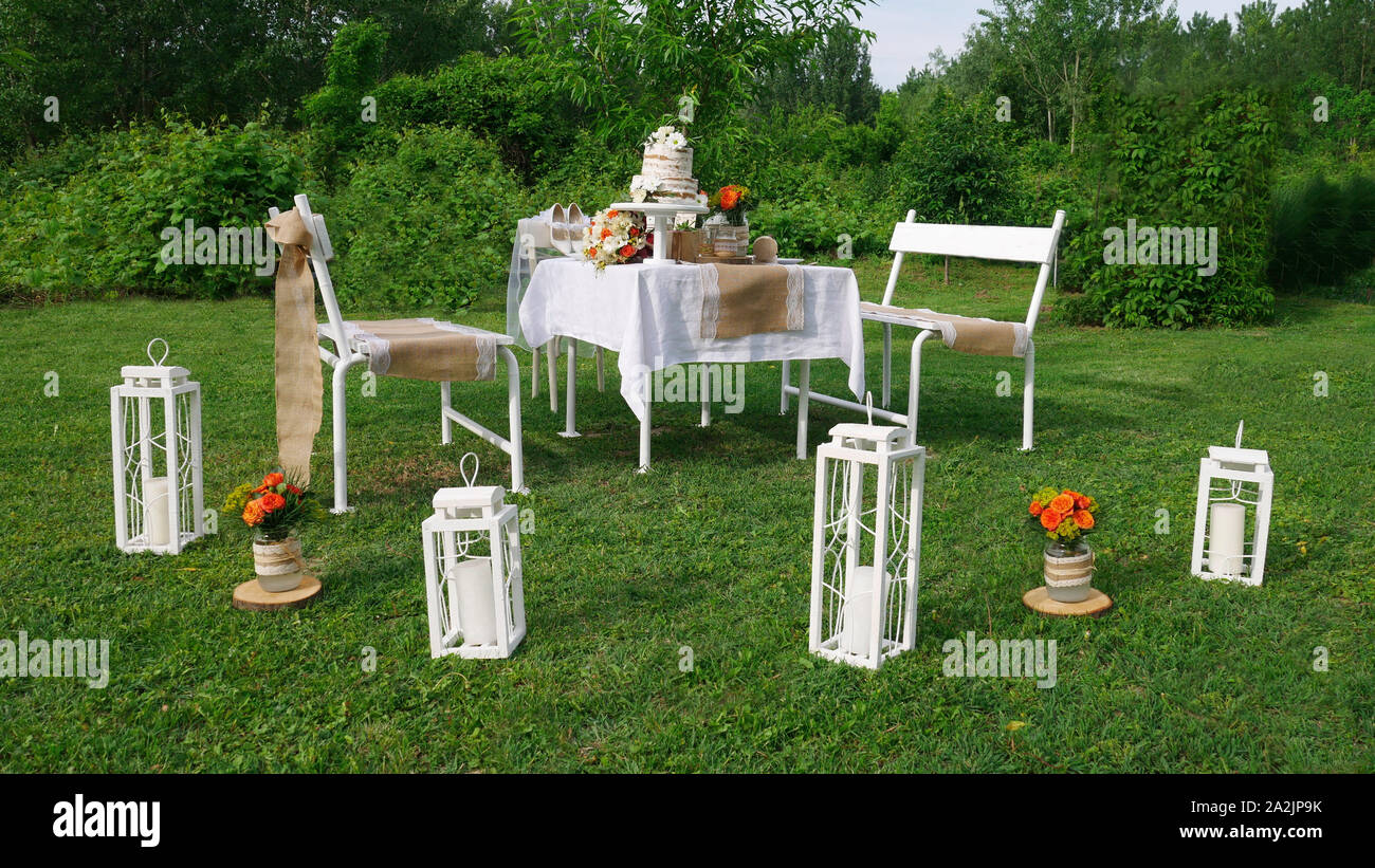 Wedding decorations for table in rustic style in nature - spring time Stock Photo