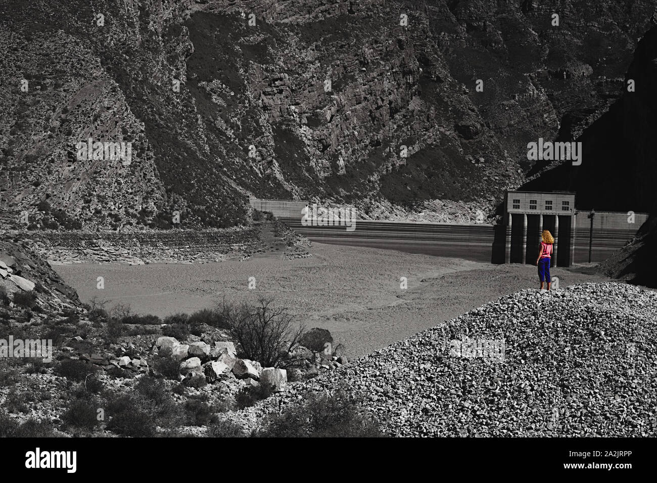 Dried Up Dam with Surveying Girl Stock Photo