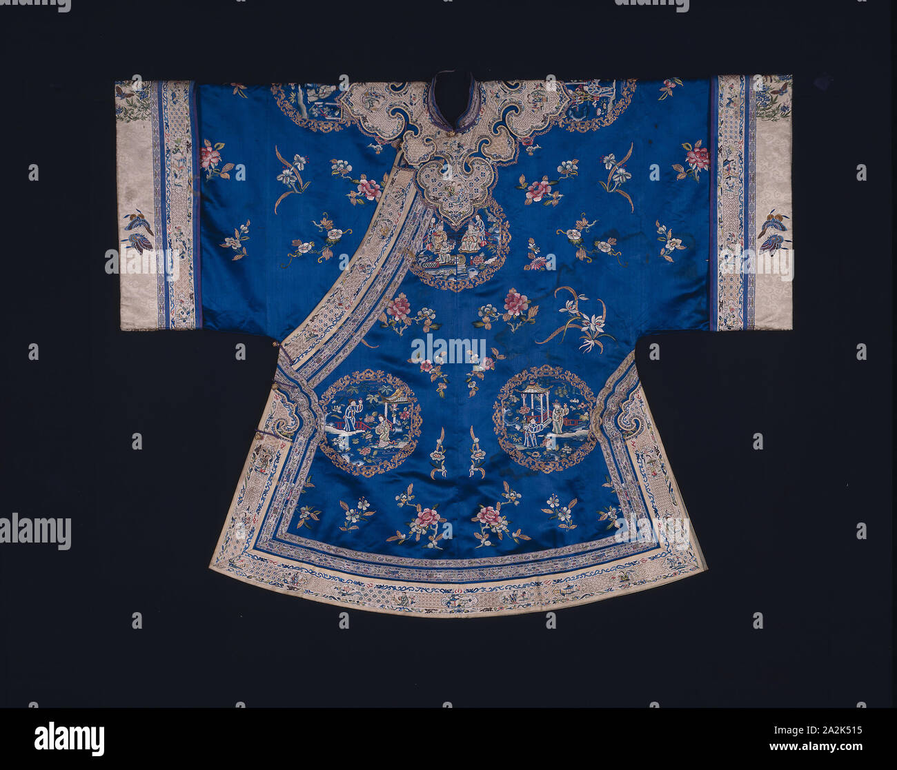Woman’s Ao (Short Robe), Qing dynasty (1644–1911), 1875/1900, Han-Chinese, China, Silk, warp-float faced 7:1 satin weave, embroidered with silk and gold-leaf-over-lacquered-paper-strip-wrapped silk in knot, satin and stem stitches, laid work and couching, sleeve facing: silk, 7:1 satin damask weave, embroidered with silk and gilt-metal-strip-wrapped silk in knot, satin, single satin, split, and stem stitches (under drawing in black ink or graphite), edging and cloud collar: silk, warp-float faced 7:1 satin weave, embroidered with silk and gold-leaf-over-lacquered-paper-wrapped silk in satin Stock Photo
