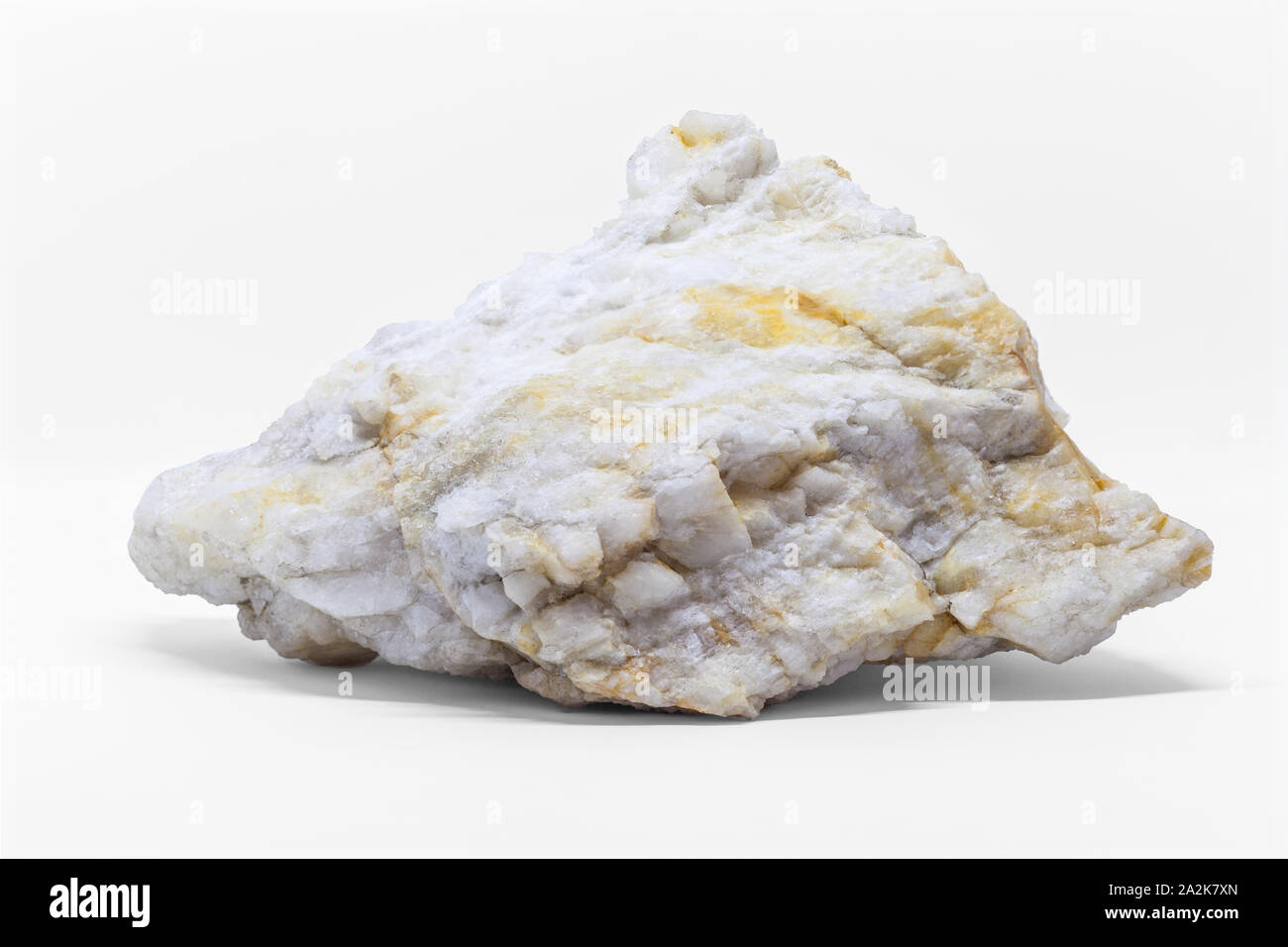 White Rock Marble isolated on white background. Piece of natural mineral close up Stock Photo