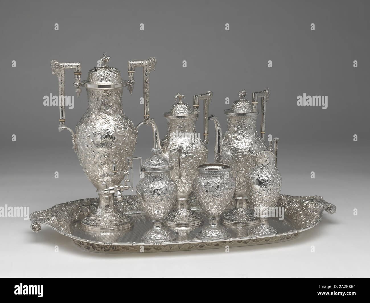 Tea and Coffee Service with Tray, 1850/1900, Andrew Ellicott Warner, American, 1786–1870, Andrew Ellicott Warner Jr., American, 1813–1896, Schofield Co. Inc., American, active 1903–65, Baltimore, Baltimore, Silver, Tray: 77.5 × 46.7 cm (31 ½ × 18 3/8 in.), urn, h.: 44.1 cm (17 3/8 in.), 1988.5 g, pot, h.: 34 cm (13 3/8 in.), 1093.6 g, pot, h.: 33.3 cm (13 1/8 in.), 1066.5 g, sugar bowl, h.: 22.5 cm (8 7/8 in.), 647.5 g, creamer, h.: 23.3 cm (9 3/16 in.), 363.4 g, slop basin, h.: 17.8 cm (7 in.), 408.9 g Stock Photo