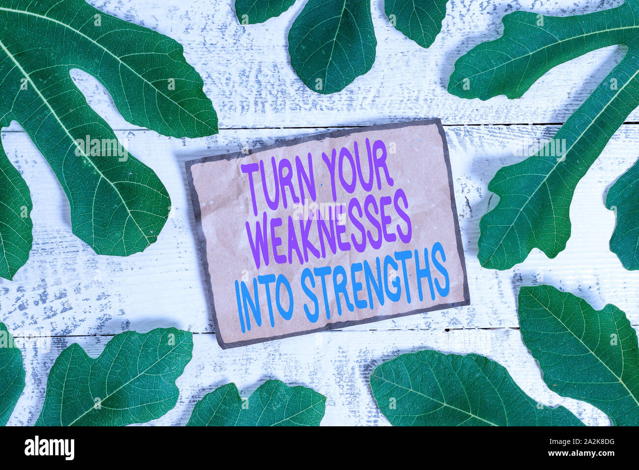 Writing note showing Turn Your Weaknesses Into Strengths. Business ...