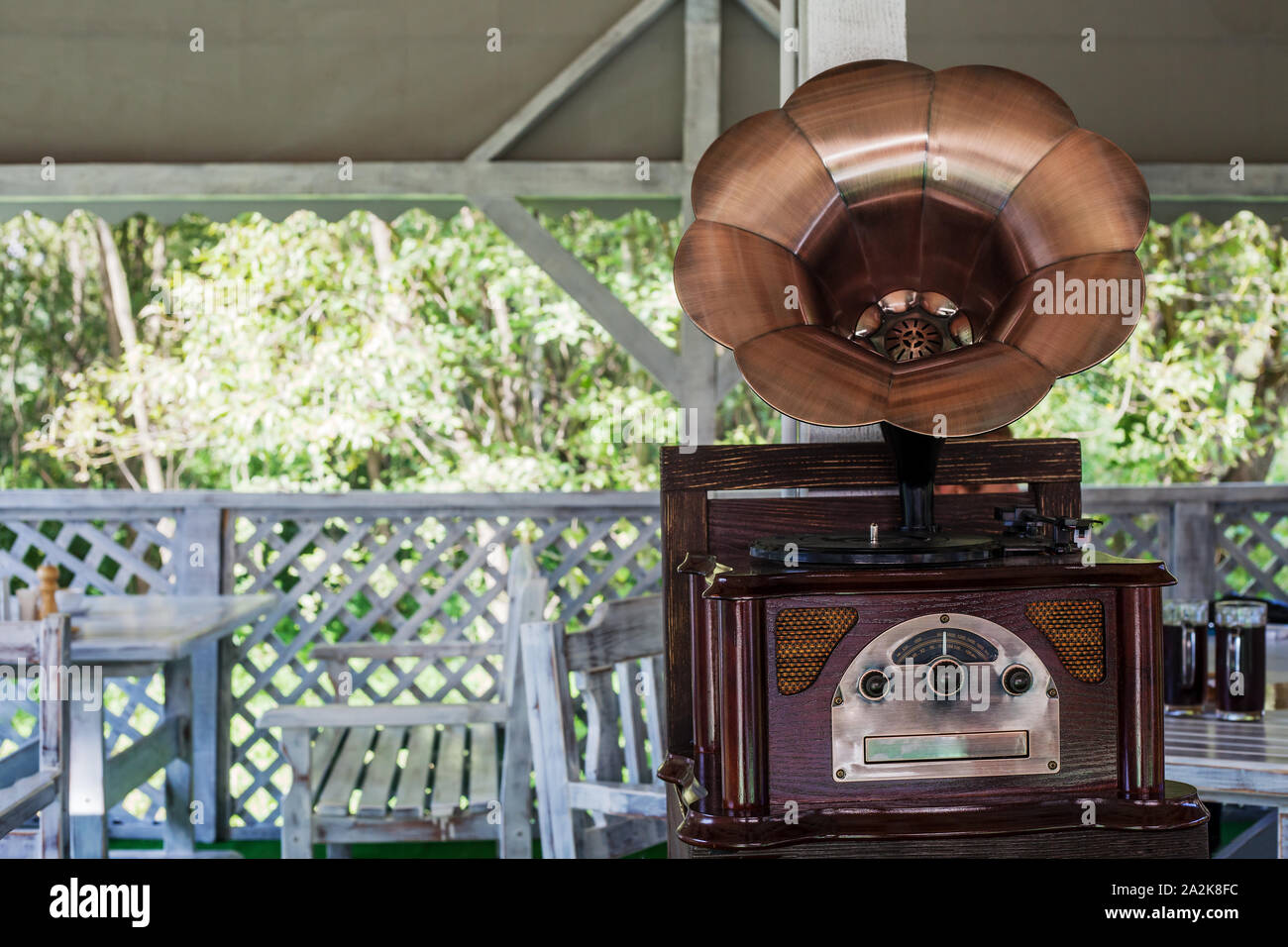 Phonograph with brass horn speaker on wood table. Retro style gramophone  record player play music Stock Photo - Alamy