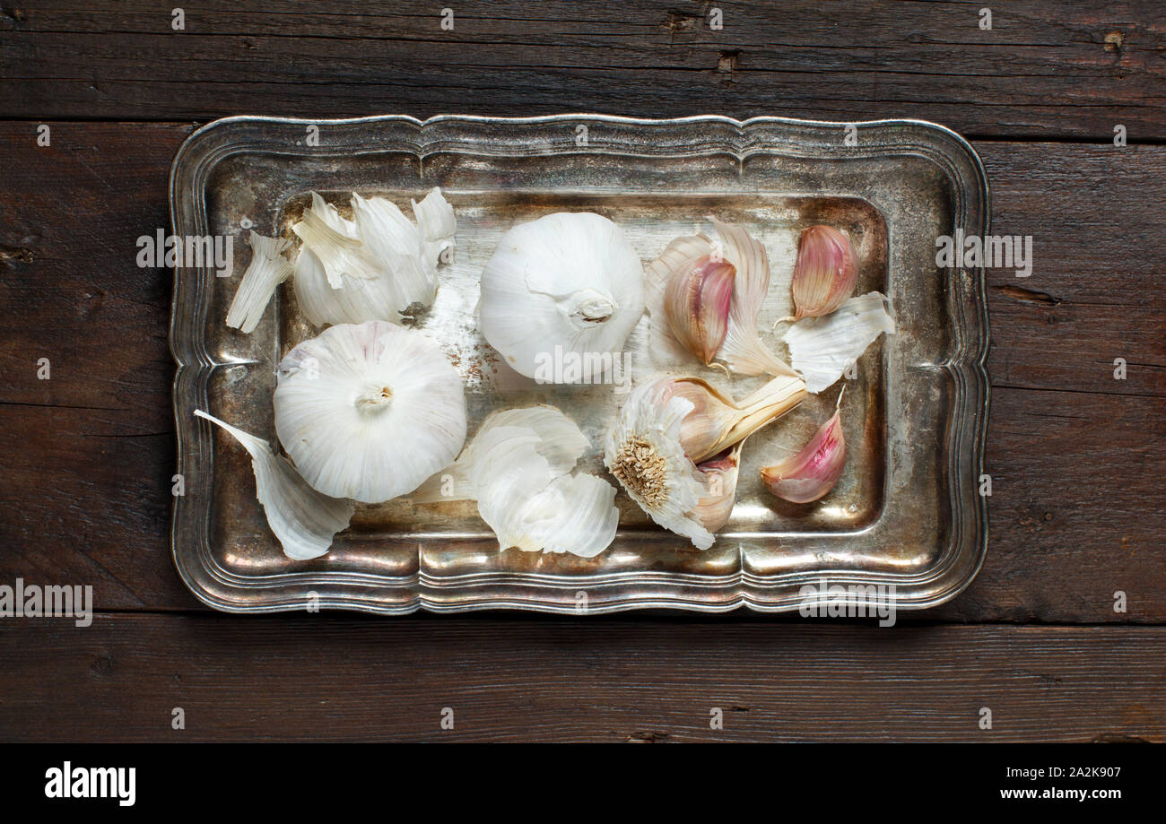 Organic garlic on the old wooden table top view Stock Photo - Alamy
