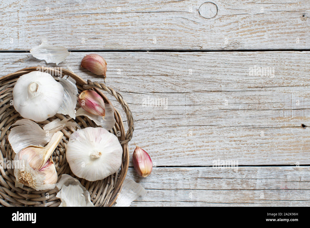 Organic garlic on the old wooden table top view Stock Photo - Alamy