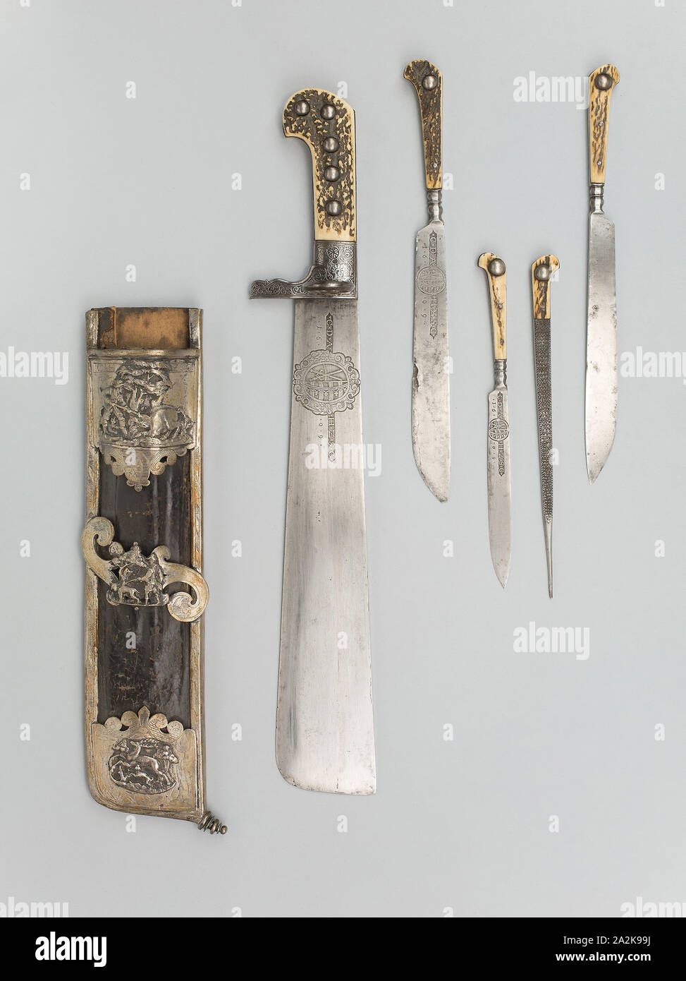 Hunting Trousse (Waidpraxe) with the Coat of Arms and Initials of Christian II, Elector of Saxony, 1609, German (Saxony), Dresden, Silversmith: Joachim Puttlost, active 1607-1652, Germany, Steel, iron, silver, gilding, staghorn, wood, and leather, Cleaver L. 47 cm (18 1/2 in.), Blade L. 32.8 cm (12 7/8 in.), Wt. 2 lb Stock Photo