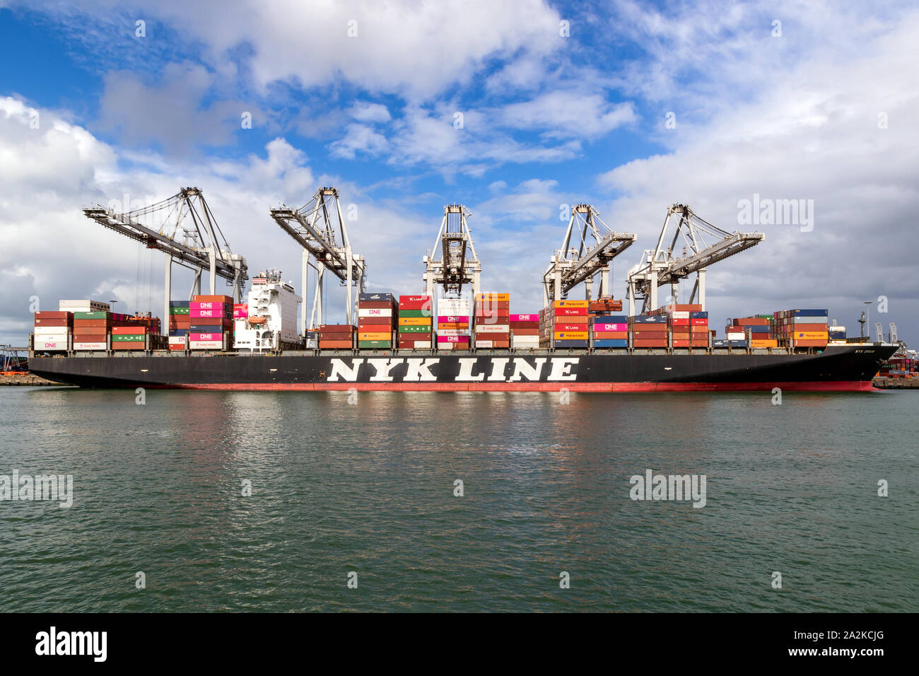 ROTTERDAM, THE NETHERLANDS - SEP 8, 2019: Nyk Line container ship is being loaded by cranes in the Port of Rotterdam. Stock Photo