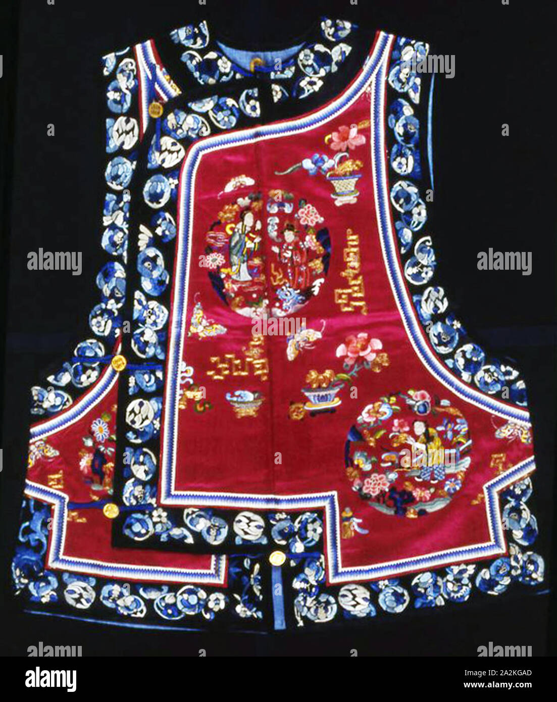 Woman’s Vest, Qing dynasty (1644–1911), 1875/1900, Manchu, China, Silk, warp-float faced 7:1 satin weave, embroidered with silk and gold-leaf-over-lacquered-paper-strip-wrapped silk in satin, single satin, and stem stitches, laid work, couching and Chinese knots, inner tape: silk and cotton, plain weave self-patterned by main warp floats, outer tape: silk, warp-float faced 7:1 satin weave, embroidered with silk in satin and stem stitches, edged with silk, warp-float faced 7:1 satin weave, lined with silk, plain weave, button loops: silk, warp-float faced 7:1 satin weave, metal buttons, 64 × 57 Stock Photo