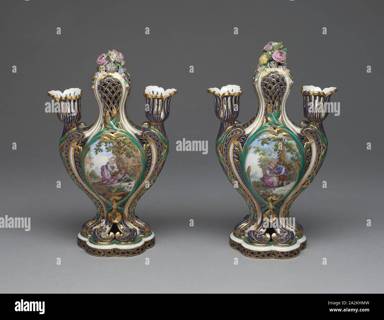 Pair of Vases (Pots Pourris à Bobèches), c. 1759, Sèvres Porcelain Manufactory, French, founded 1740, Designed by Jean-Claude Duplessis, (French, fl. 1745/48-1774, died 1783), Painted by André-Vincent Vieillard (attributed to), (French, 1717-90, active 1752-90), Sèvres, Soft-paste porcelain, polychrome enamels, and gilding, 1994.371.1: H. 24.1 cm (9 1/2 in Stock Photo