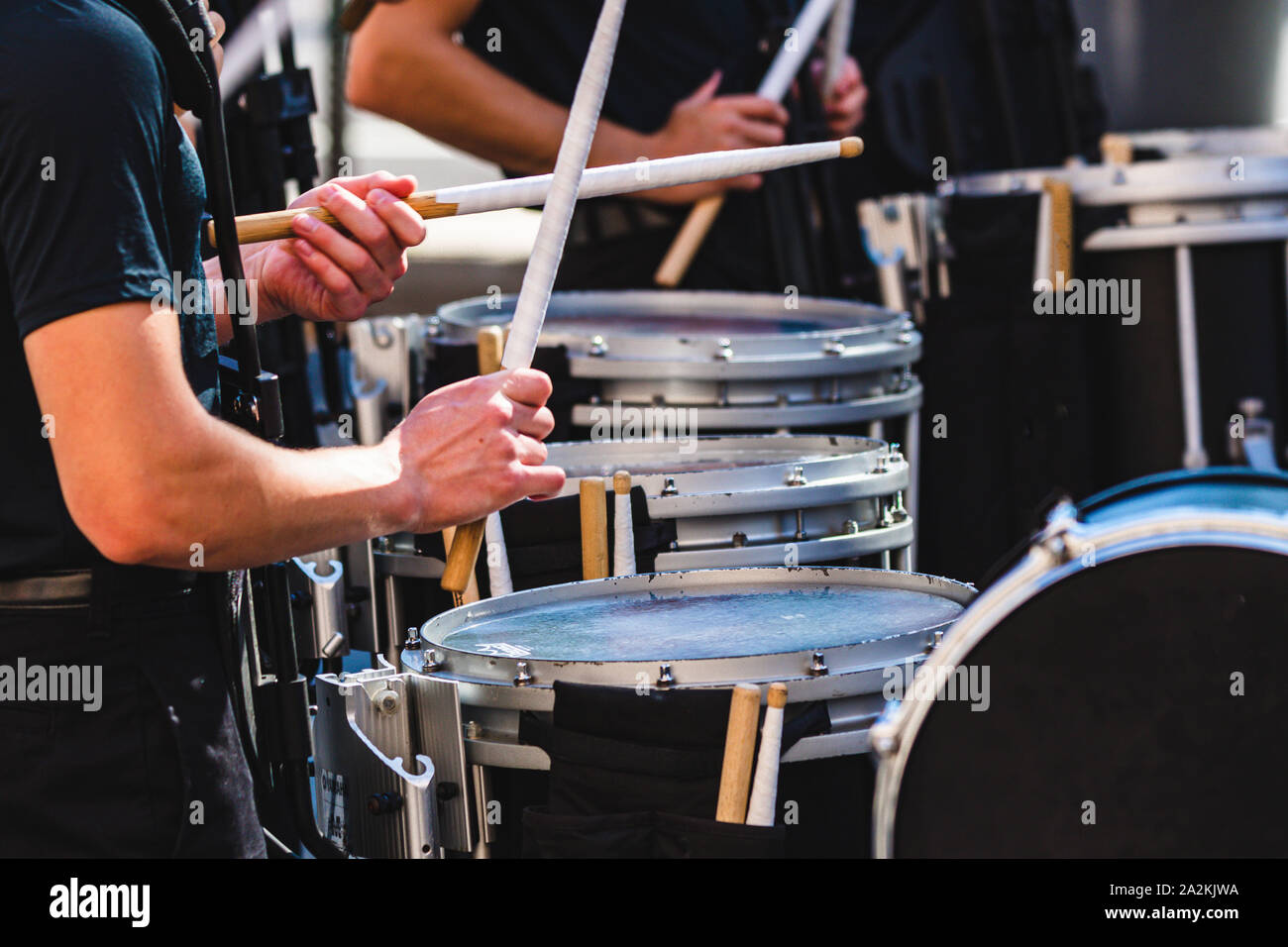 tapping out the starting cadence during warm ups off the field Stock Photo