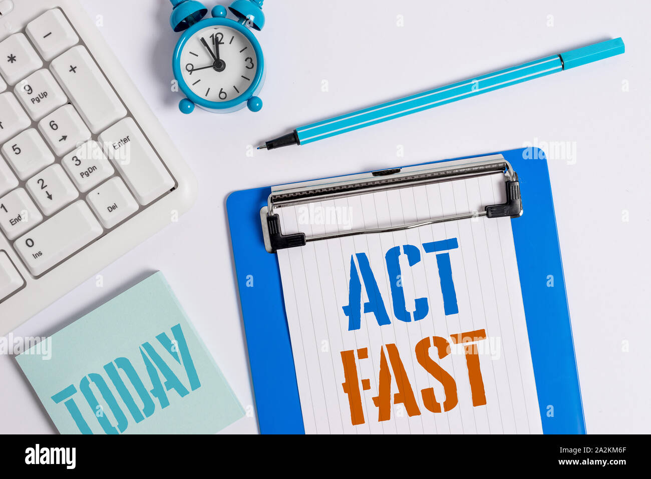 Writing note showing Act Fast. Business concept for Voluntarily move in the highest state of speed initiatively Flat lay above table with clock pc key Stock Photo