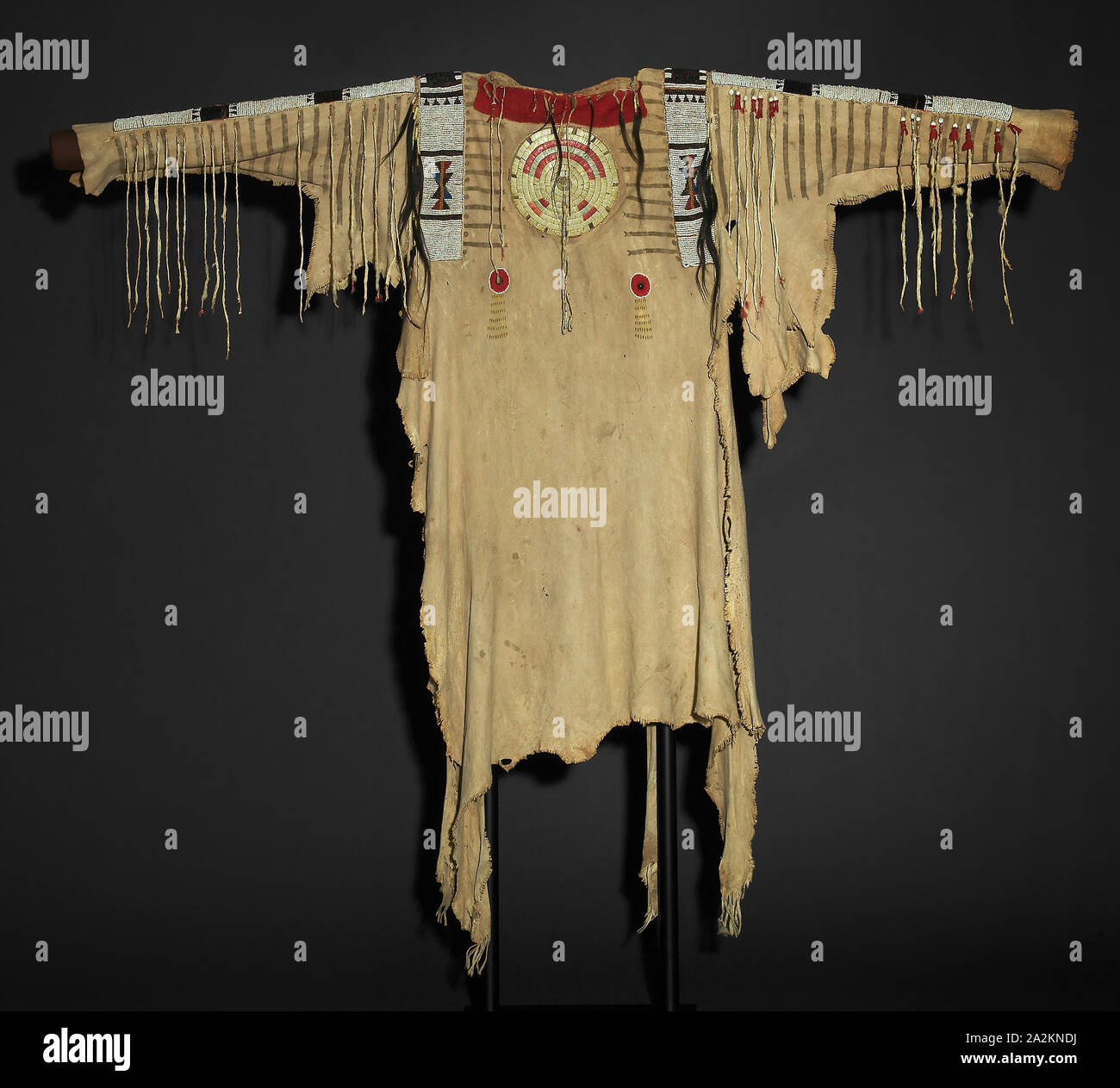 War Shirt, 1830/40, Upper Missouri River Tribe, Missouri, United States, Missouri, Deer hide, ermine tails, glass pony beads, hair, porcupine quills, and trade cloth, Appro×. 101.6 × 50.8 cm (40 × 20 in Stock Photo
