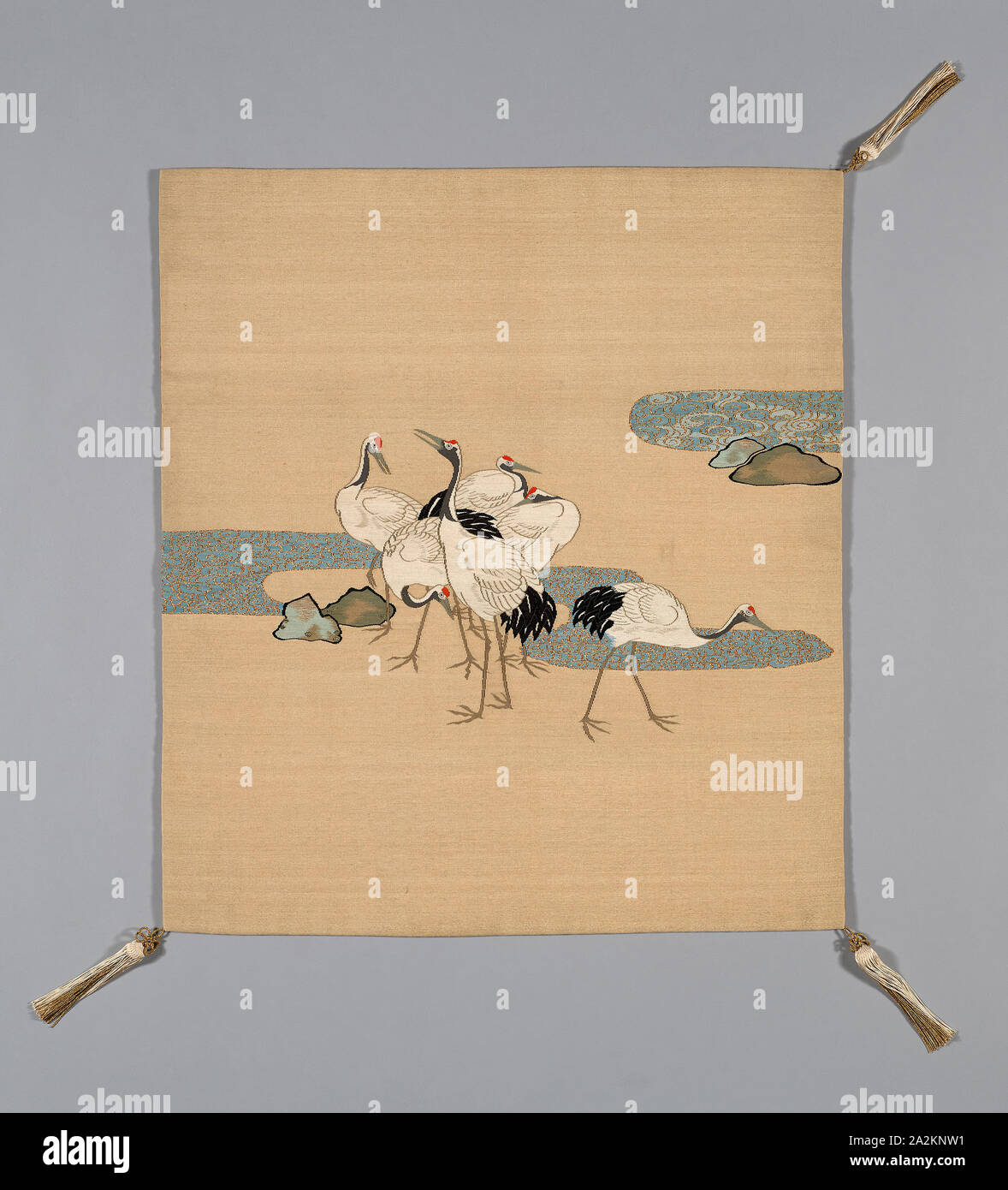 Fukusa (Gift Cover), late Edo period (1789–1868)/ Meiji period (1868–1912), 19th century, Japan, Mon side: silk, warp-faced, weft ribbed plain weave (shioze), dye extracted through stenciled chemical dye stripper (bassen), patterned side: cotton, silk and gold-leaf-over-lacquered-paper strip wrapped silk, slit tapestry weave with wrapped outlining wefts (tsuzure), paper interlining, Sewn with front and lining matched in size (Tachikiri awase), corners: silk, gold-leaf-over-lacquered-paper strip wrapped silk, tubular 1:1 oblique interlacing over cotton core, knotted, silk-wrapped cotton ball Stock Photo