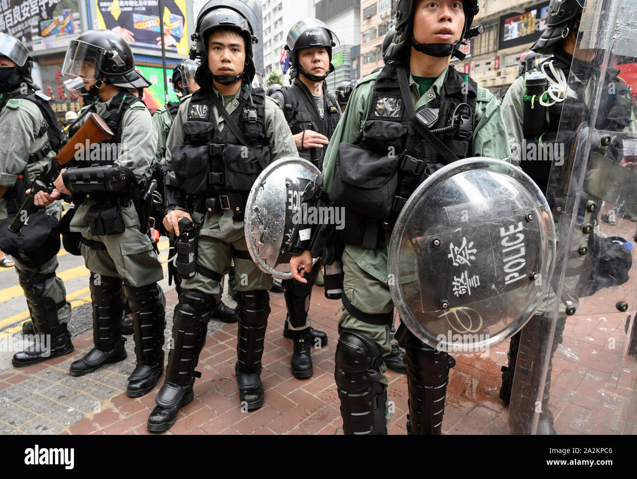 29 September 2019  Hong Kong.  Global Anti Totalitarianism March. Thousands of people took part in an unauthorized march from Causeway Bay to Admiralty in Hong Kong.  Police stand at Causeway Bay at the beginning of the march. Stock Photo
