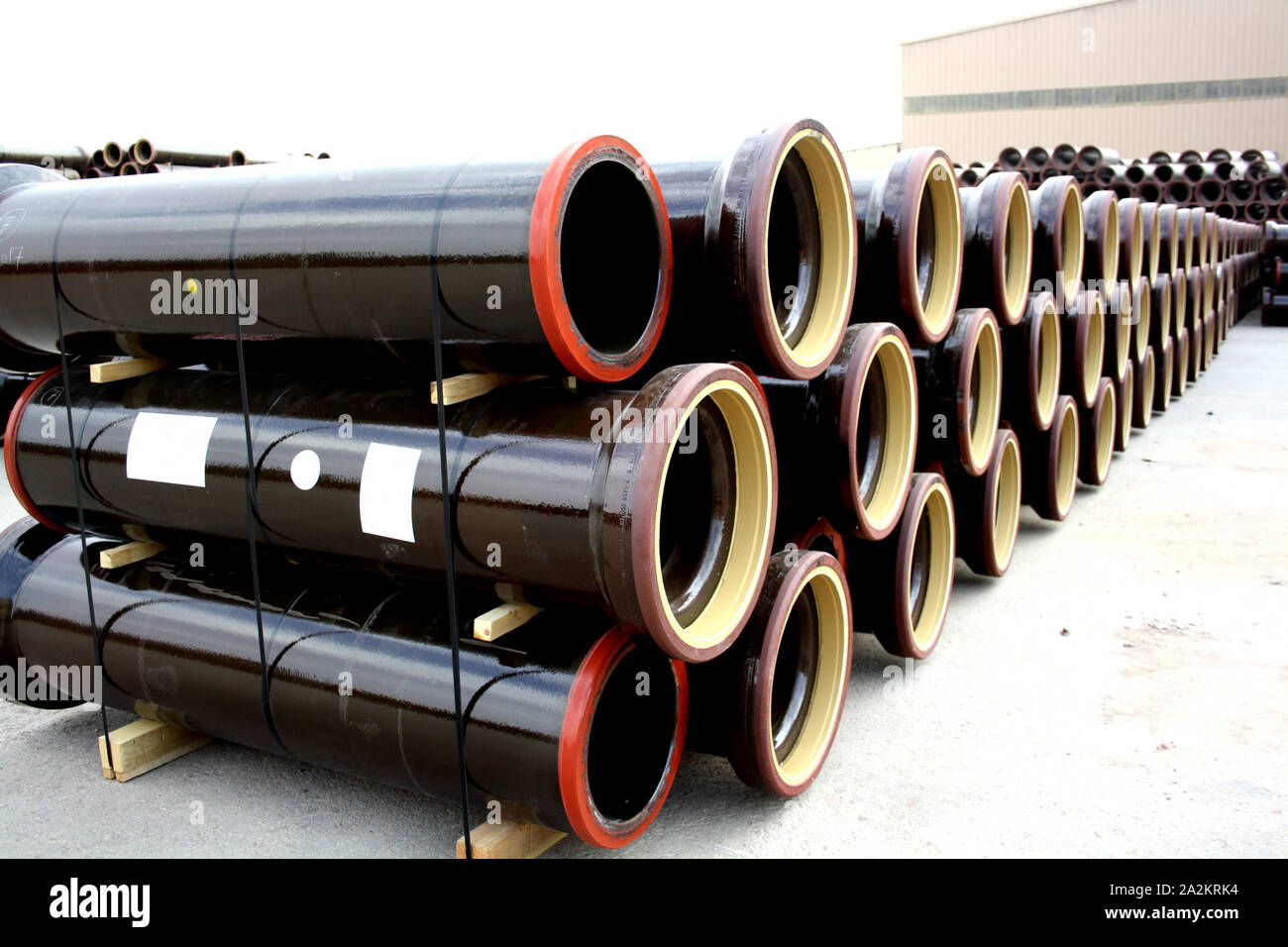 Stacks of PVC and ceramic water pipes - Image Stock Photo
