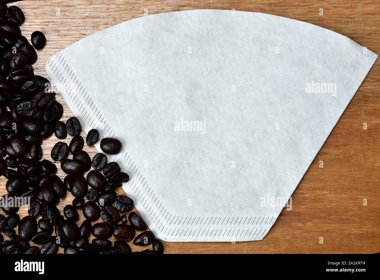 roasted coffee bean and paper colander Stock Photo