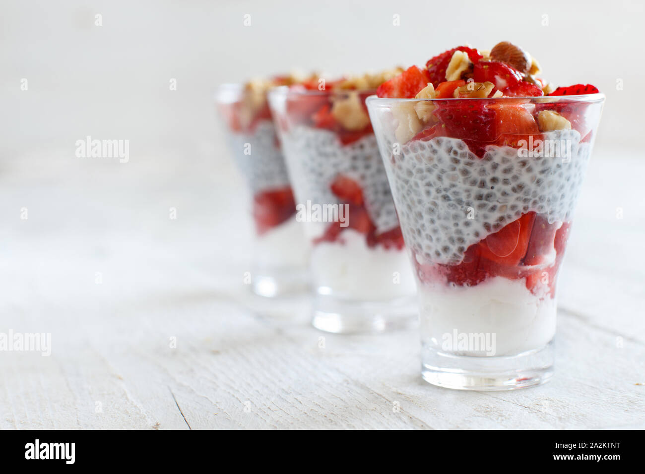 Chia pudding Strawberry parfait with greek yogurt and nuts Stock Photo