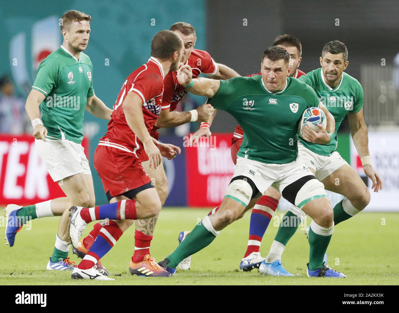 Kobe, Japan. 3rd Oct, 2019. CJ Stander (3rd from L) of Ireland evades a ...