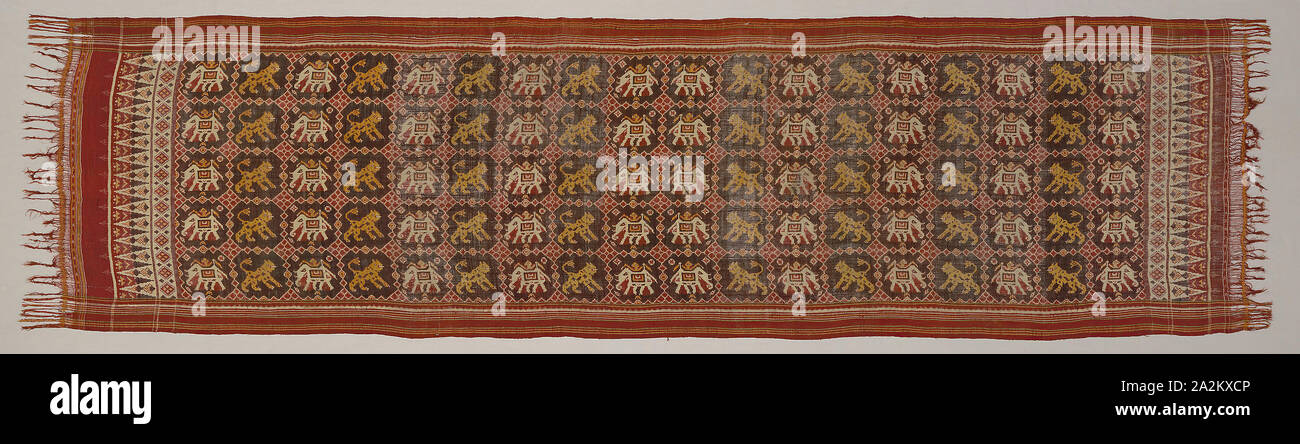 Ceremonial Cloth with Pattern of Elephants and Tigers, 19th century, India, Gujarat, India, Silk, plain weave, warp and weft resist dyed (double ikat) and stripes of plain weave,  bands of plain weave with main warp fringe, both selvages present, 101.6 x 391.2 cm (40 x 154 in Stock Photo