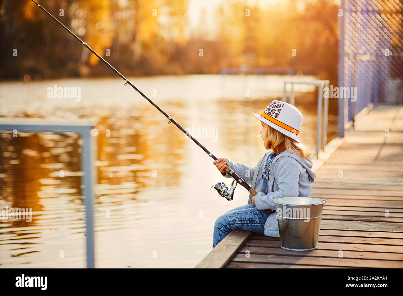 Little girl fishing hi-res stock photography and images - Alamy