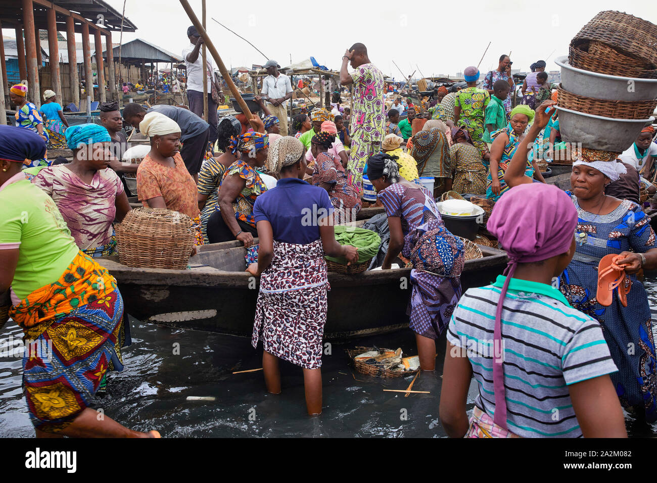 Benin Cotonou Trading fish and ferry boat near the river 27-6-2018 foto Jaco Klamer Stock Photo