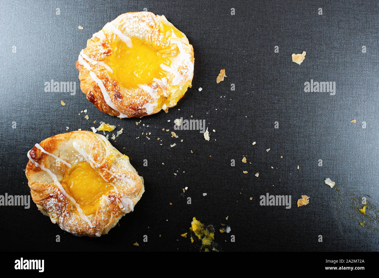 Danish custard pastry on black background with copy space Stock Photo