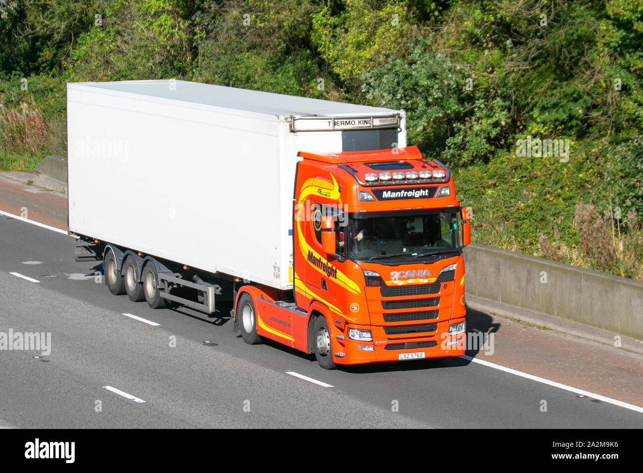 heavy bulk Haulage delivery trucks, haulage, lorry, transportation, truck, cargo, Scania S series vehicle, delivery, transport, industry, supply chain freight, on the M6 at Lancaster, UK Stock Photo