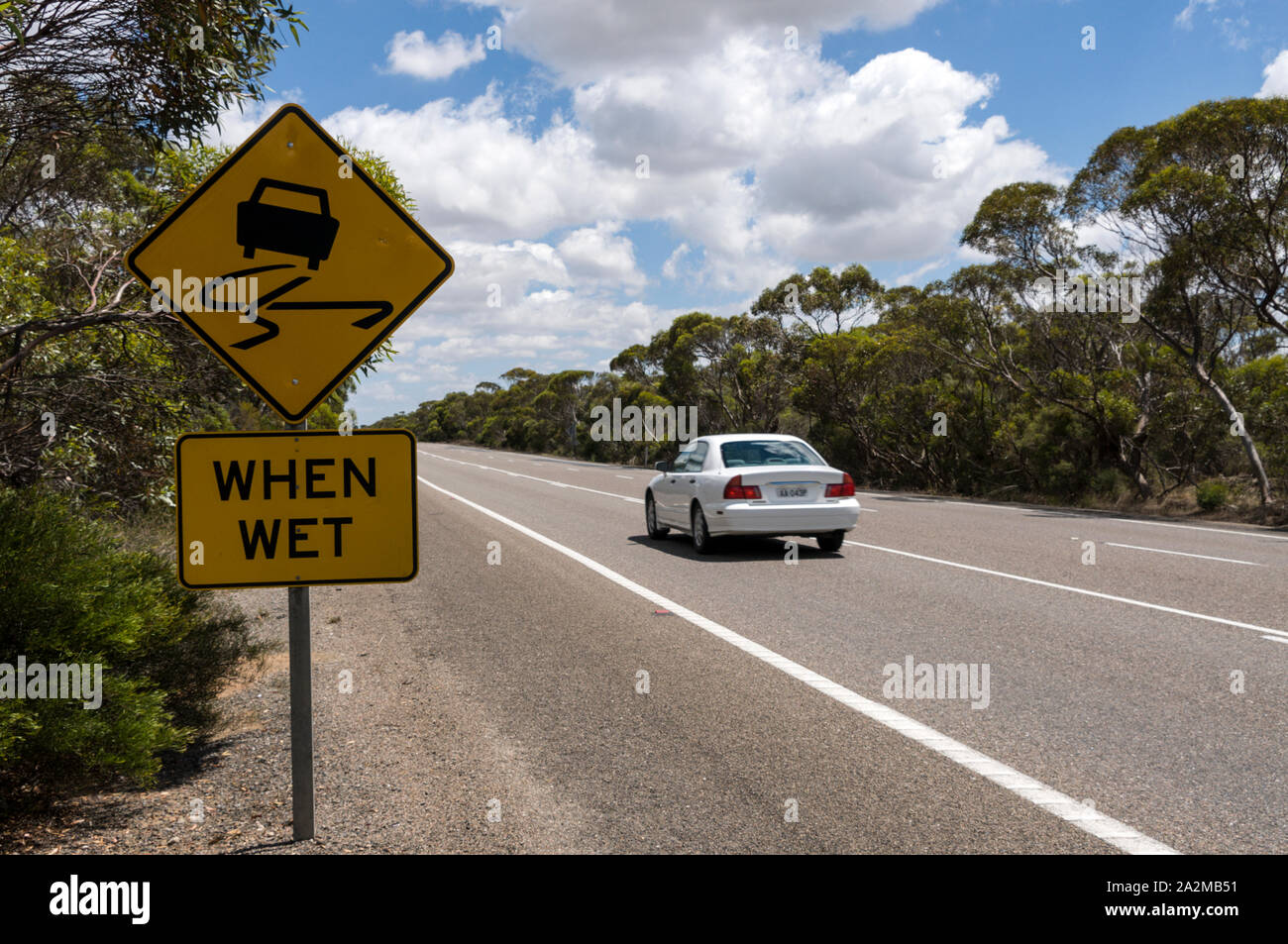 A slippery warning road sign in the State of Southern Australia Stock Photo