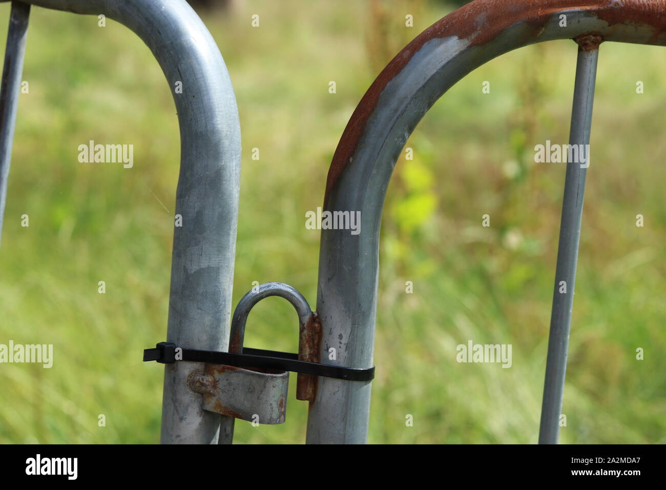 A rusted metal safety barrier. Stock Photo