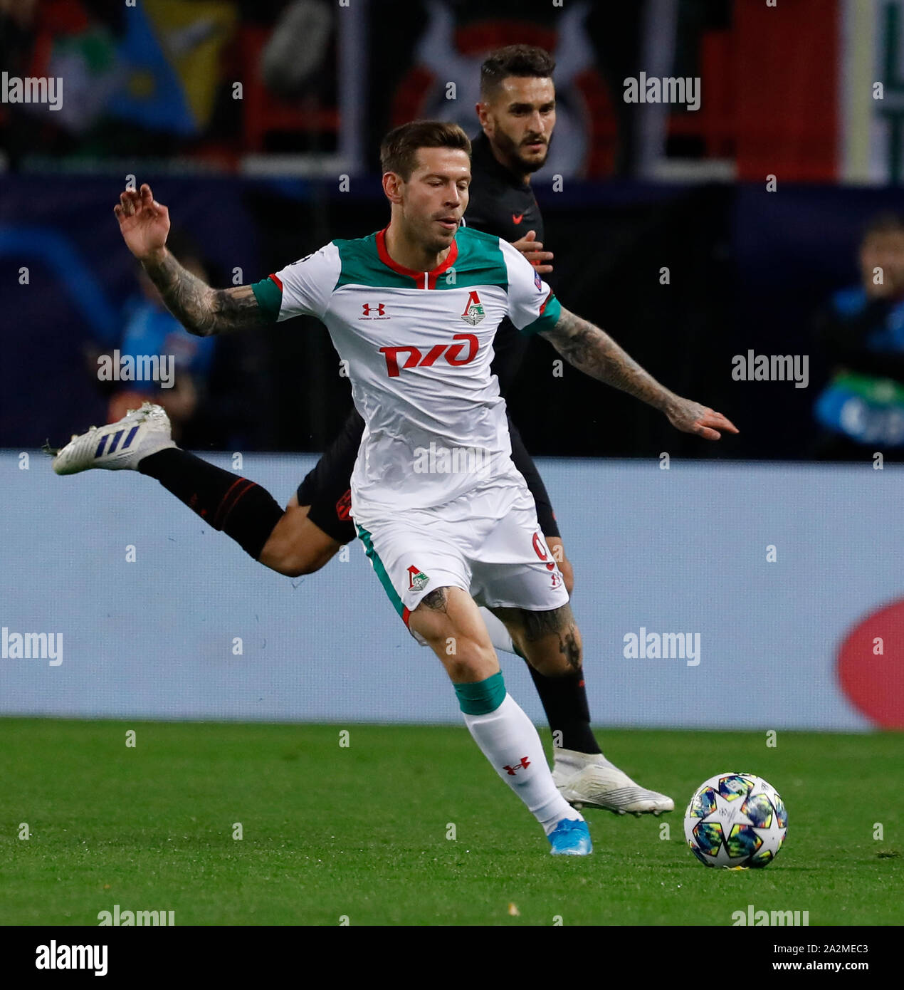 MOSCOW, RUSSIA - OCTOBER 01: Fyodor Smolov of Lokomotiv Moskva and Koke of Atletico Madrid vie for the ball during the UEFA Champions League group D match between Lokomotiv Moskva and Atletico Madrid at RZD Arena on October 1, 2019 in Moscow, Russia. (Photo by MB Media) Stock Photo
