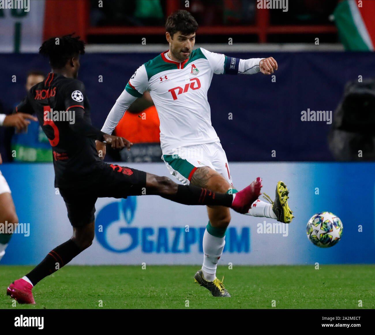 MOSCOW, RUSSIA - OCTOBER 01: Vedran Corluka (R) of Lokomotiv Moskva and Thomas Partey of Atletico Madrid vie for the ball during the UEFA Champions League group D match between Lokomotiv Moskva and Atletico Madrid at RZD Arena on October 1, 2019 in Moscow, Russia. (Photo by MB Media) Stock Photo