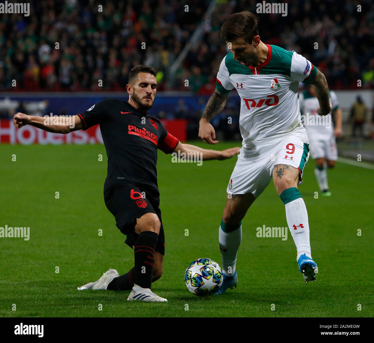 MOSCOW, RUSSIA - OCTOBER 01: Fyodor Smolov (R) of Lokomotiv Moskva and Koke of Atletico Madrid vie for the ball during the UEFA Champions League group D match between Lokomotiv Moskva and Atletico Madrid at RZD Arena on October 1, 2019 in Moscow, Russia. (Photo by MB Media) Stock Photo