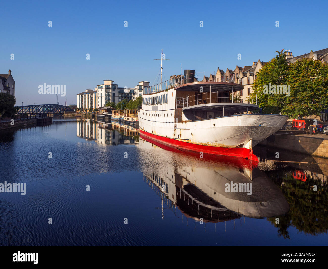 Old steam ship Ocean Mist a former restautant under convesrion to a floating hotel on Water of Leith City of Edinburgh Scotland Stock Photo