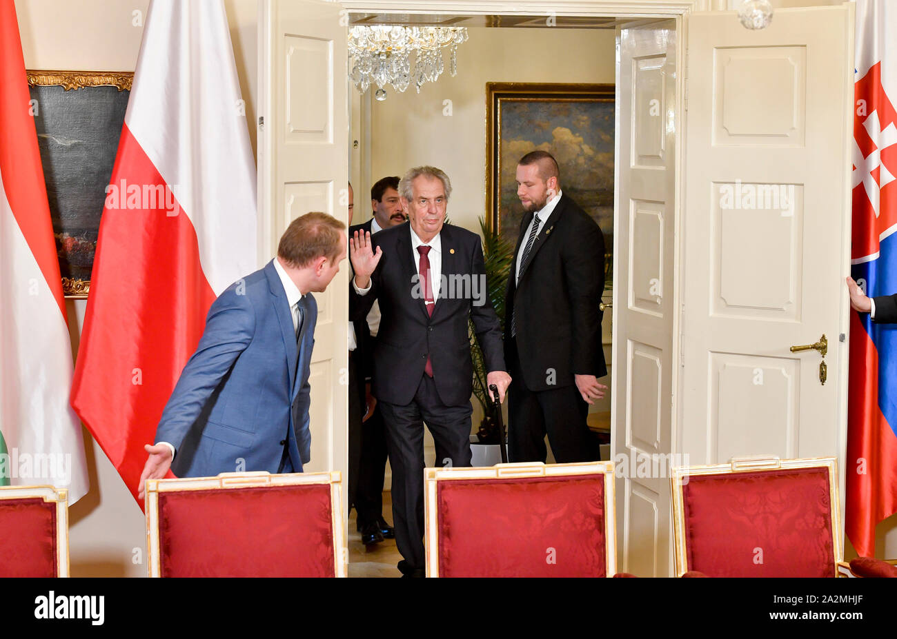 Lany, Czech Republic. 03rd Oct, 2019. Head of the Presidential Office Protocol section Vladimir Krulis, left, prepares a chair as Czech President Milos Zeman arrives to a news conference after plenary session of Visegrad Group (V4; Czech Republic, Slovakia, Poland, Hungary) countries, Slovenia and Serbia's presidents, in Lany chateau, Czech Republic, on Thursday, October 3, 2019. The debate at the summit focused on the perspectives of the EU enlargement by the Western Balkans countries as well as the EU accession talks with Serbia. Credit: Vit Simanek/CTK Photo/Alamy Live News Stock Photo