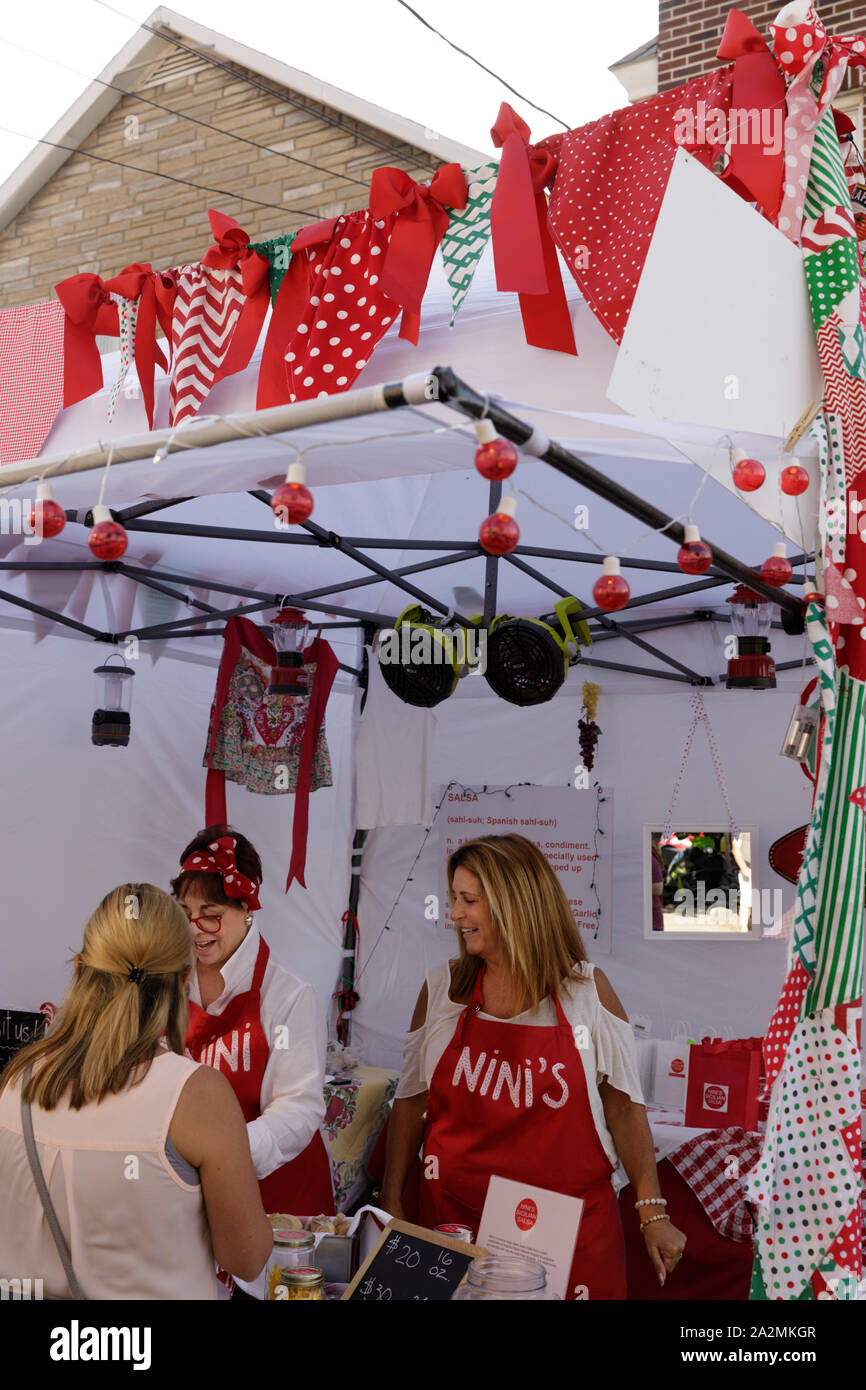 Italian Festival, Schenectady, New York: Women at a colorul booth. Stock Photo