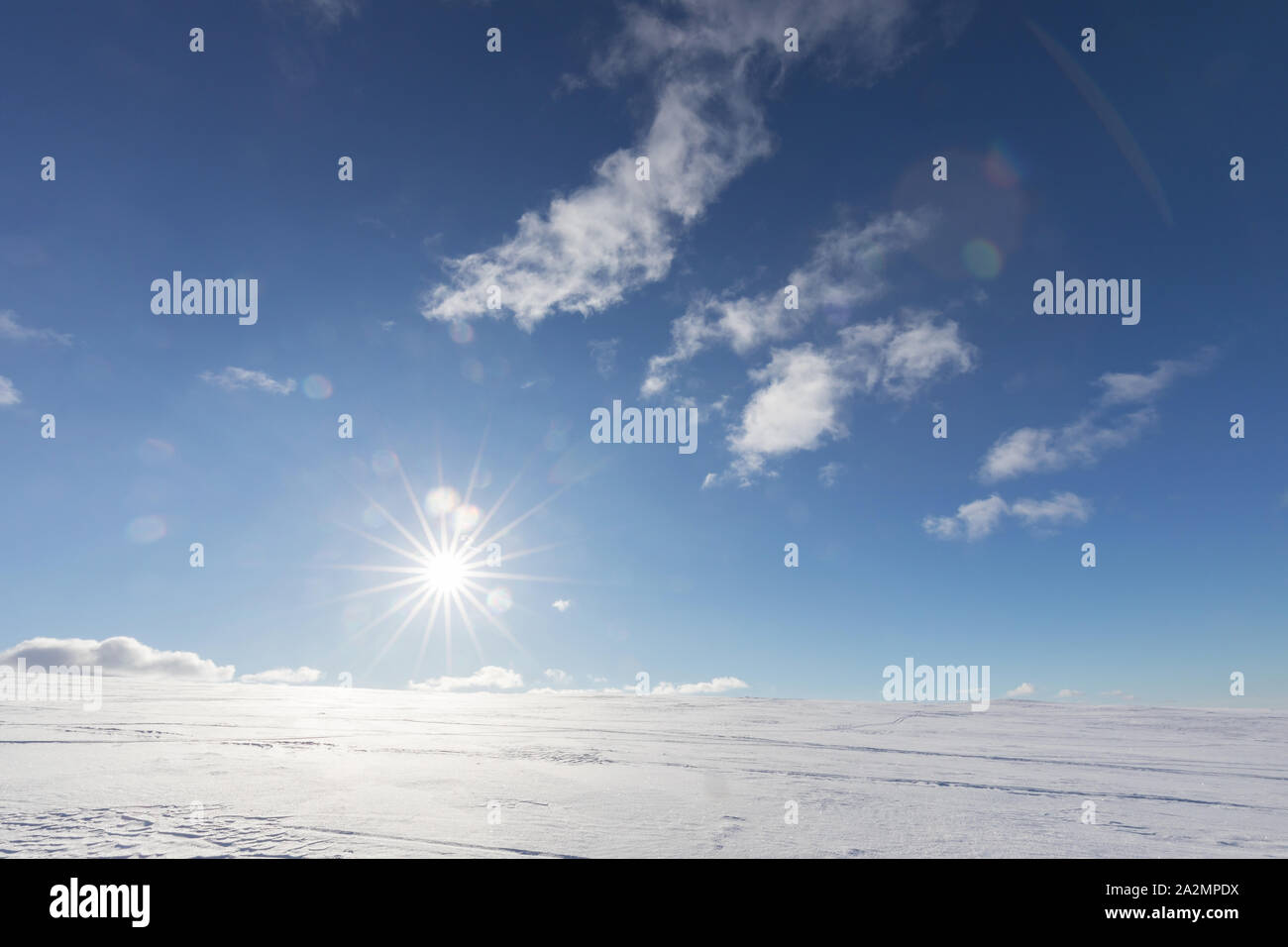 Sun is shining at the top of fell in Lapland Stock Photo