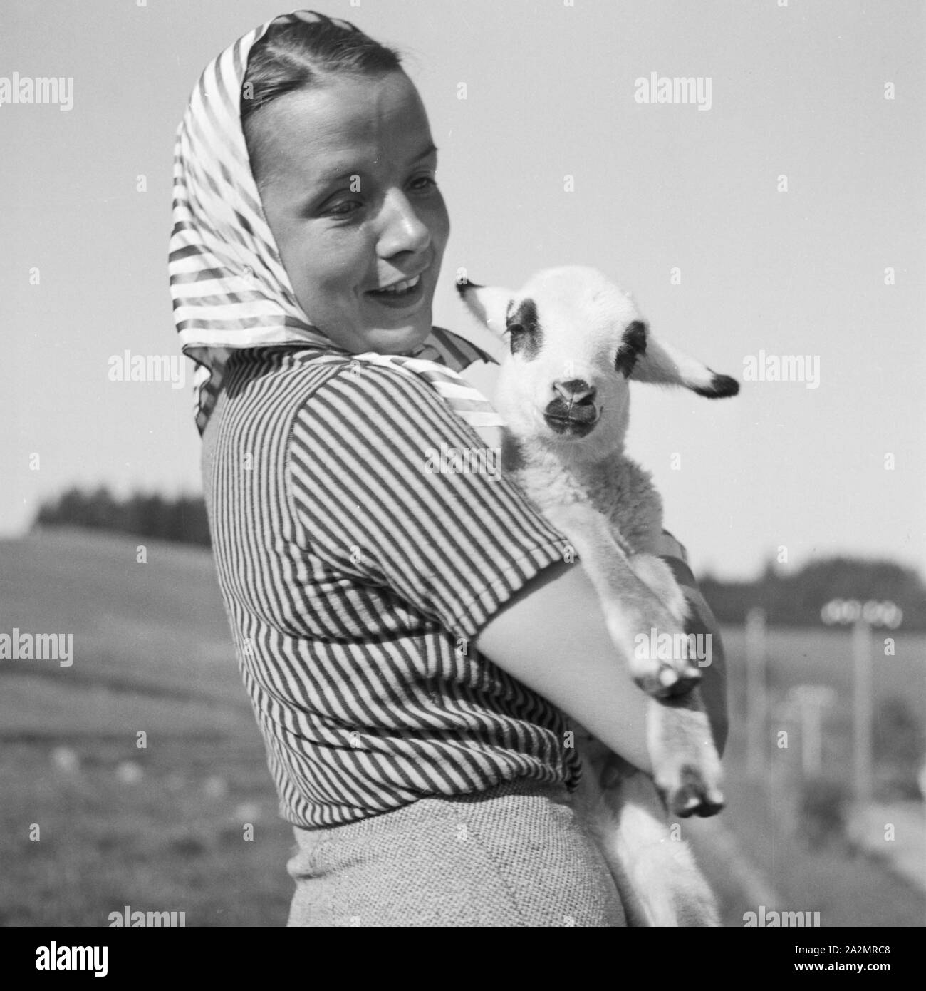 Holding a lamb hi-res stock photography and images - Alamy