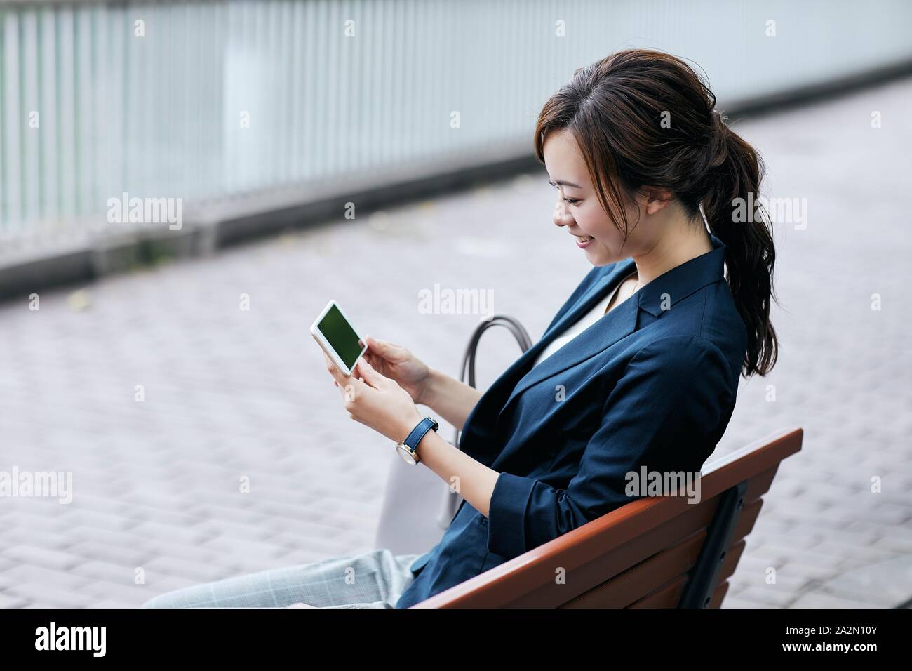 Young Japanese businesswoman downtown Stock Photo