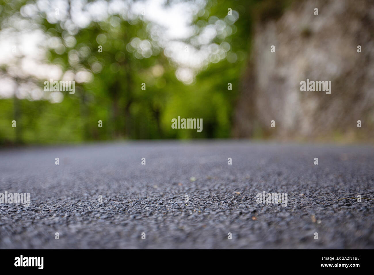 Road from the ground level with bokeh background Stock Photo - Alamy