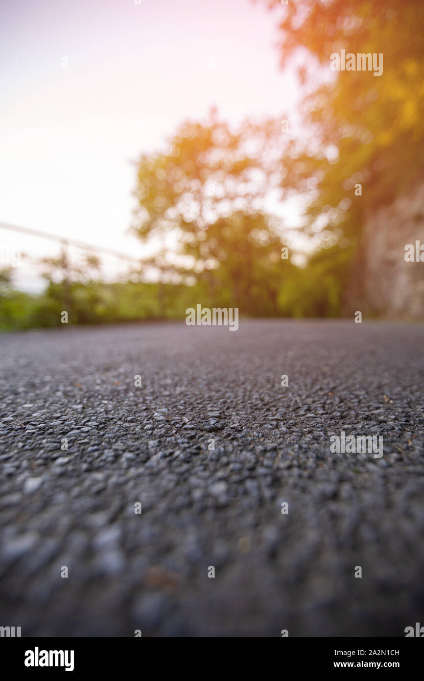 Road from the ground level with bokeh background Stock Photo - Alamy