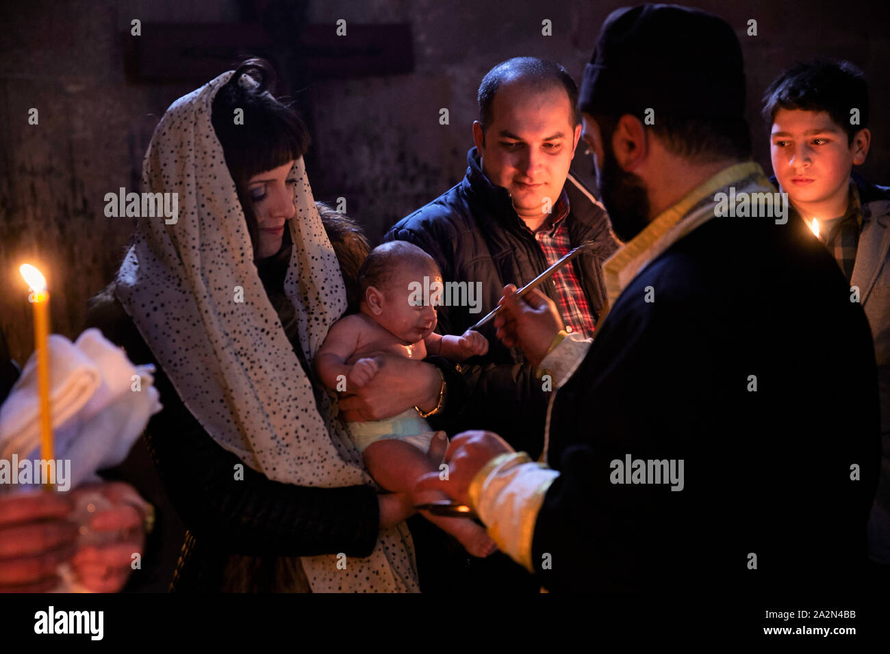 Georgia Karsani St Nino church. Baptizing baby with parents.19-01-2015 foto: Jaco Klamer Stock Photo