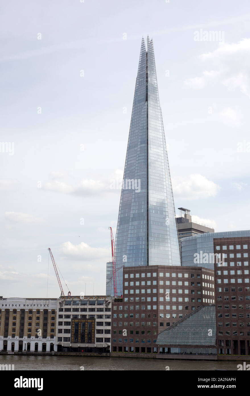 shard skyscraper looming over the river thames in london Stock Photo