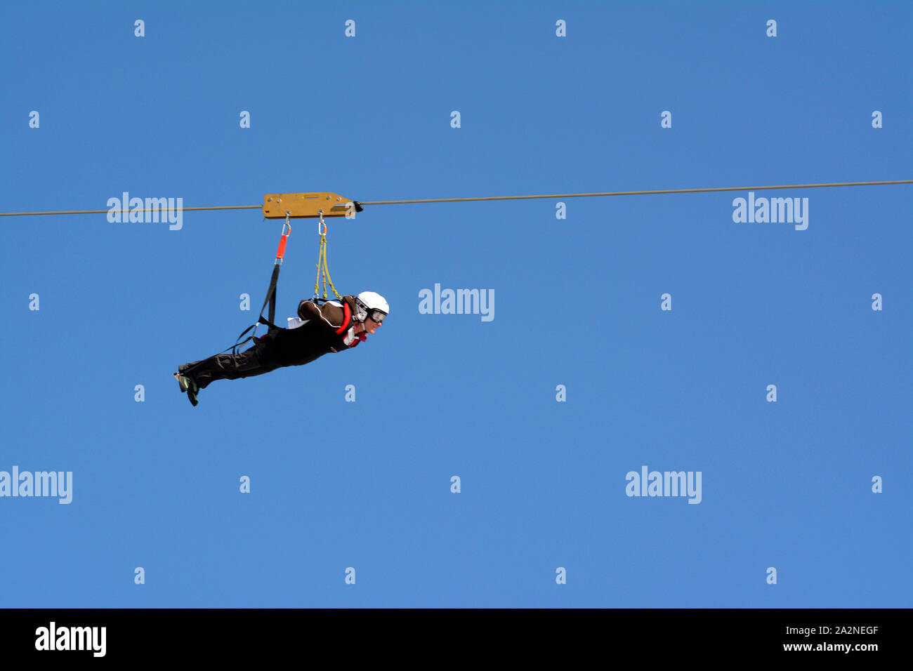 Person on Zip wire line, France Stock Photo